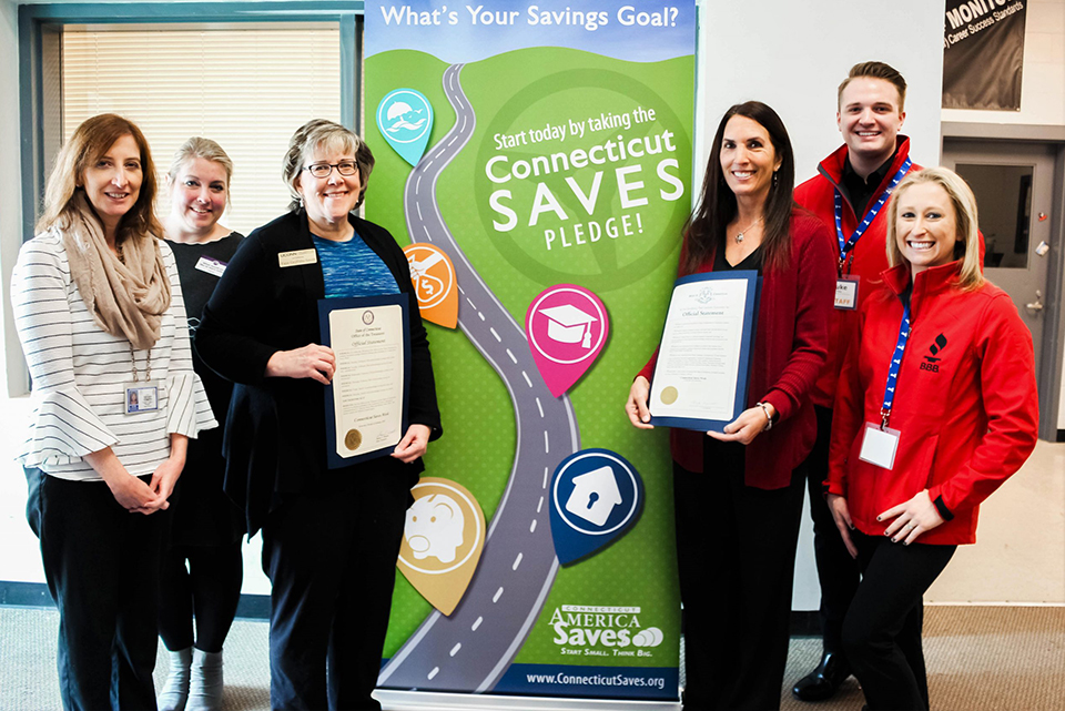 Financial educators receiving an award.